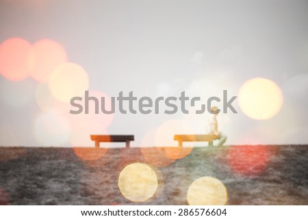 man on the chair waiting for someone.Abstract blur background .