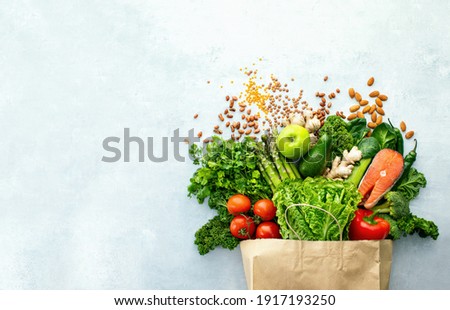Healthy food shopping or delivery concept, top down view on a variety of fresh produce in a paper bag, composition with copy space for a text  Stockfoto © 