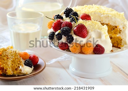 Old fashioned home baked cake with light cream decorated with freshly picked berries