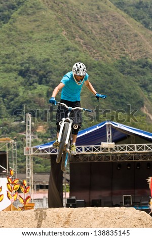 ZAMORA REGION, ZAMORA, ECUADOR-APRIL 27:Rider Juan Alfonso Reece does mountain bike jump tricks in Zamora, Ecuador on April 27, 2013. Extreme sports demonstrations were part of tourism conference.