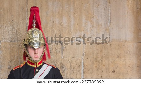 LONDON, UK - OCTOBER,10, 2014: A royal horse guard standing in front of the Horse Guards Building in London, United Kingdom