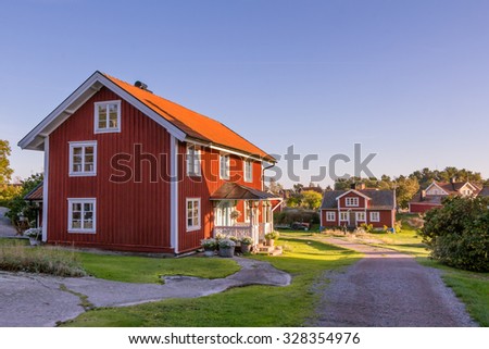 HARSTENA, SWEDEN â?? SEPTEMBER 30, 2015:Red cottages on the island Harstena in Sweden, principally known for the seal hunting that was once carried out there. It is now a tourist attraction.