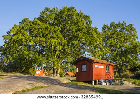 HARSTENA, SWEDEN â?? SEPTEMBER 30, 2015:Cottage and ships on the island Harstena in Sweden, principally known for the seal hunting that was once carried out there. It is now a tourist attraction.