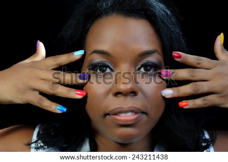 Close Up of a young black woman with painted nails