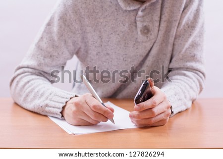 Businessman sitting at office desk and plans its work