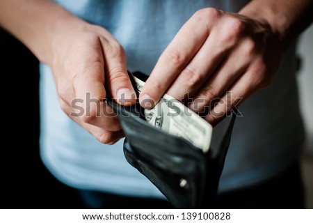 Man gets money from the wallet