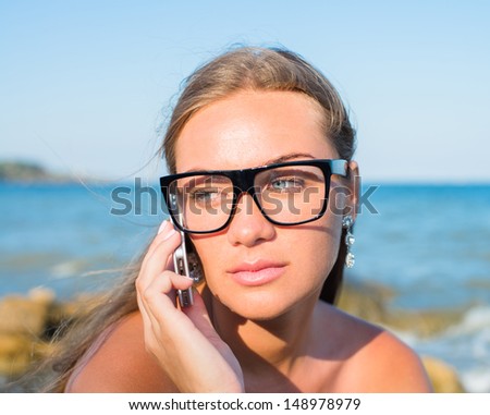 young beautiful woman speaks on the phone