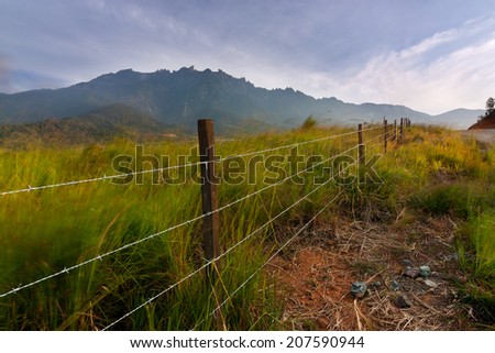 Rural landscape with Mount Kinabalu at the background in Kundasang , Sabah, East Malaysia, Borneo