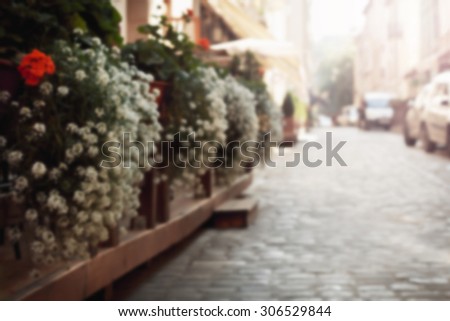 gardening at the street outside a restaurant. Blurring background
