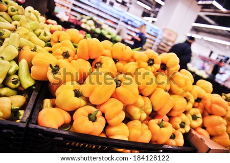 Variety of peppers in boxes in supermarket