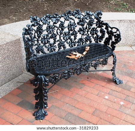 Cosiness of a solitude.  A metal bench in Washington, DC.