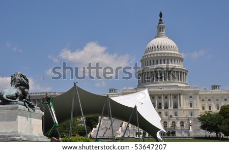 The canvas tent of the next mass action before the Capitol is constructed.