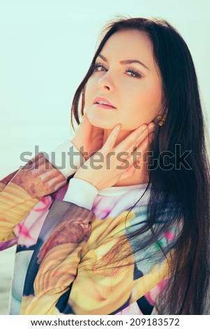 Young and beautiful woman in sunset light. lengthiest, beautiful hair