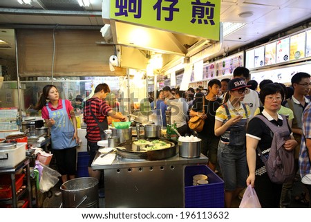 TAIPEI, TAIWAN-JULY 14: Hungry crowds flock to the Shilin Night Market food court in the Shilin District of Taipei July 14, 2013. Shilin Market is the most popular and largest night market in Taiwan.