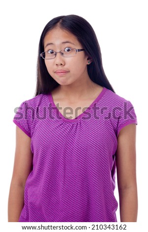 Studio portrait of an Asian teenage girl with eyes wide opened.