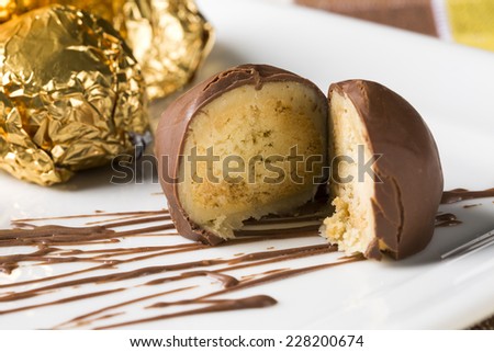 Homemade natural chocolate candies on white background