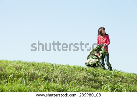 mom takes a walk with a child