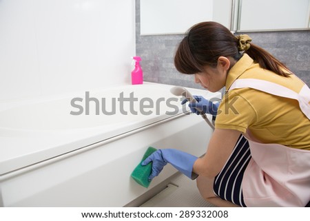 woman cleaning up bathroom