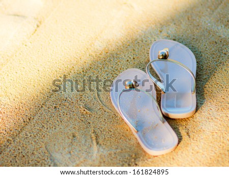 flip flop shoes on sand beach, thailand