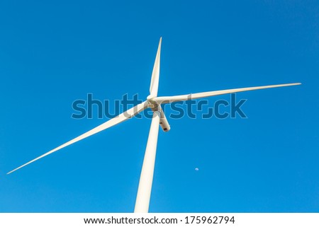 Wind turbine electric  generator with blue sky in Huai Bong district, Thailand