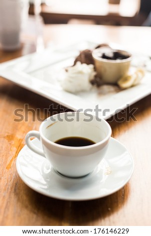 used cup of espresso coffee on grunge table