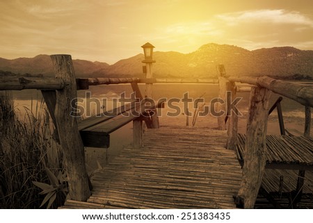Vintage concept small wood pier and stair to lake.