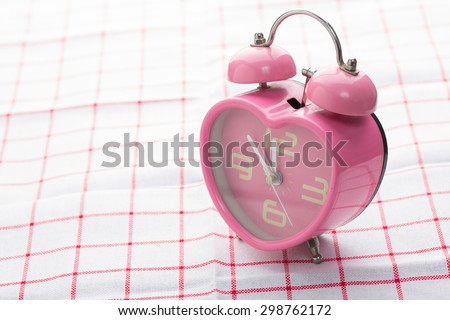 Pink heart shape alarm clock.