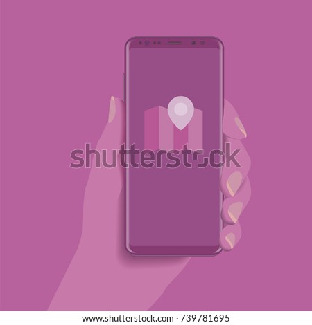 Nice female hand holding a full screen cell phone in pink monochrome colors