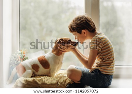 Similar – Image, Stock Photo Kids hugging dog on beach