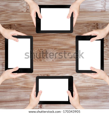 Many hand in the tablet PC, in wood textured.