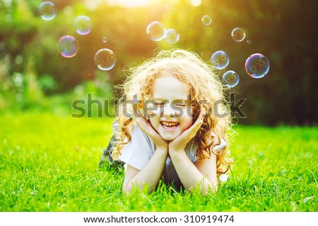 Girl lying in green grass. Healthy Smiling. Medical concept. Instagram filter.