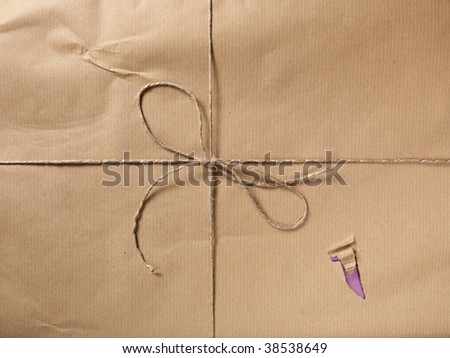 A broken packet closed with a string and bow.