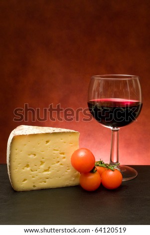Food And Drinks - Still life with cheese and red wine.