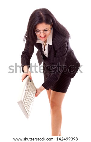Angry lady manager throwing a keyboard on the floor.