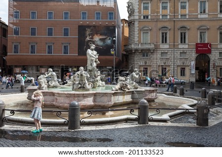 ROME, ITALY - JUNE 18, 2014: Little girl playing, enjoying few rays of sun, near the Moor Fountain in Navona Square. Navona Square and its fountains are great touristic attractions in Rome.