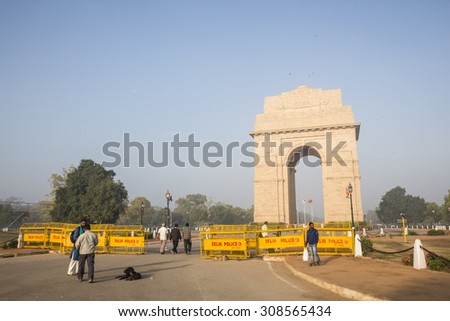 DELHI INDIA - mar 11 :  scene of india gate from east side barrier fence at rajpath, india gate is war memorial of first world war on march, 11, 2015, india