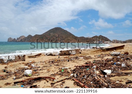 Trash on the Medano beach Cabo San Lucas and view of mountains
