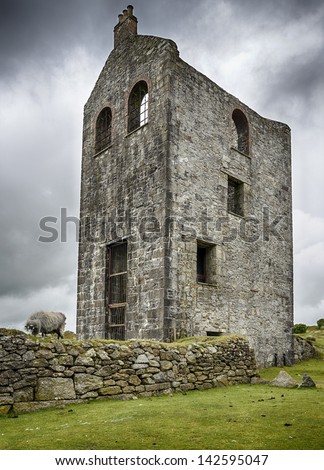 An old ruined engine house left over from Cornish tin and copper mining at Minions on Bodmin Moor in Cornwall