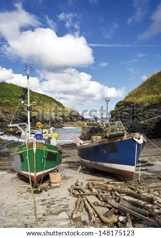 Colourful fishing boats on the beach at Portloe a small fishing village on the south coast of Cornwall