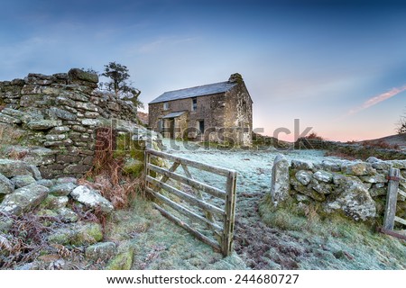 An old abandoned cottage on a frosty winter morning high up on Bodmin Moor in Cornwall