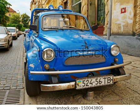 LVIV, UKRAINE - AUG 15: Vintage restored and tuned blue ZAZ-965 Zaporozhets car (released circa 1960 in USSR) parked at Hrushevskiy street on August 15, 2013 in Lviv, Ukraine.