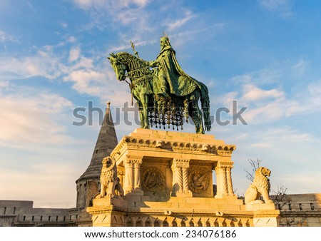 King St Stephen statue at Matthias Church in the rays of the setting sun in Budapest, Hungary