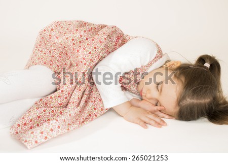 Nap time, Little girl sleeping, studio shot on white background