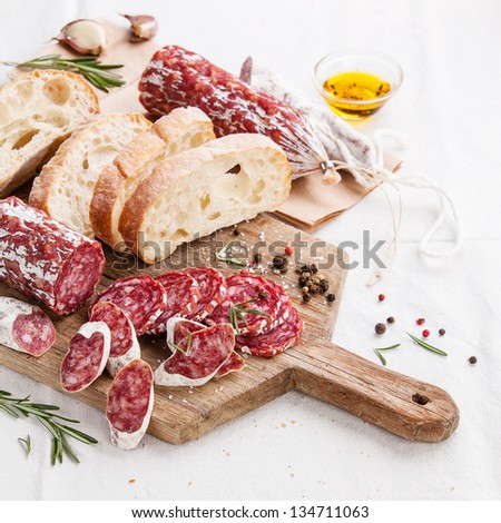 http://image.shutterstock.com/display_pic_with_logo/136306/134711063/stock-photo-italian-salami-on-wooden-cutting-board-134711063.jpg