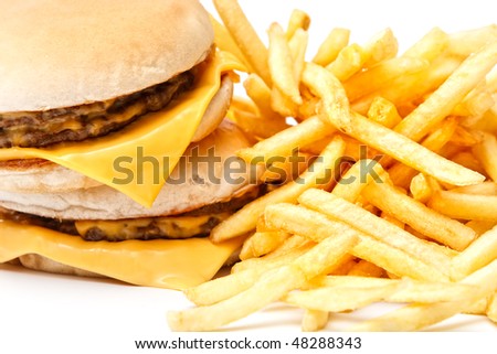 Lunch time with cheeseburger and french fries on white background Close-up