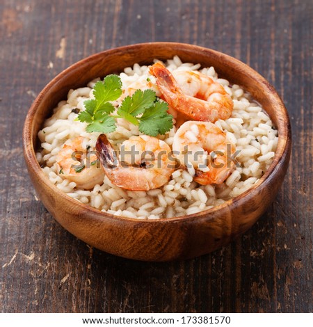 Shrimps Risotto in wooden bowl