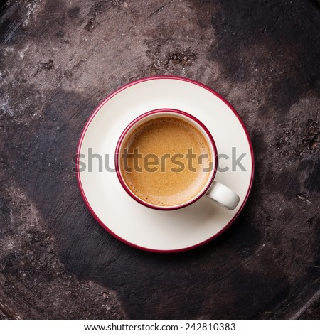 Coffee cup on dark textured background