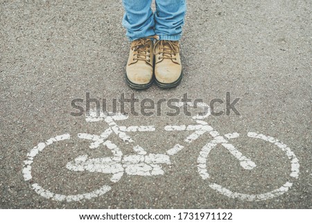 Image, Stock Photo chil next to Bike Symbol on Street