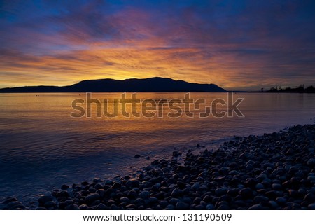 Orcas Island Sunset. A beautiful and dramatic sunset over Orcas Island in the San Juan Islands of Puget Sound in western Washington State, USA.