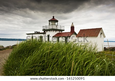 Discovery Park Lighthouse. The historic West Point Lighthouse is located on the shore of Seattle, Washington in Discovery Park.